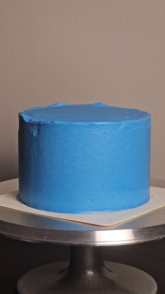 Smooth blue buttercream celebration cake